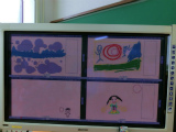 写真:電子黒板に表示された子どもたちの作品